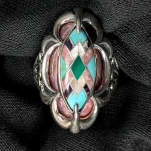 Sterling silver ring by Carolyn Pollackfeaturing an intricate inlay design with